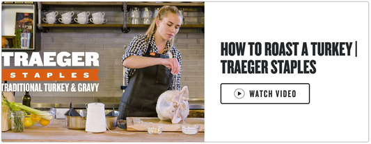 Woman in apron preparing a turkey with Traeger Staples branding.