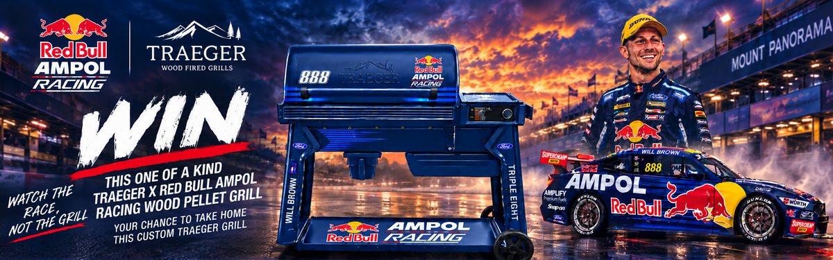Promotional banner for a Red Bull Racing x Traeger grill giveaway. It features a large blue Traeger smoker grill in the center, flanked by a photo of Red Bull Racing driver Sammy Wood Pelley on the right, set against a dramatic sunset sky over a racetrack.